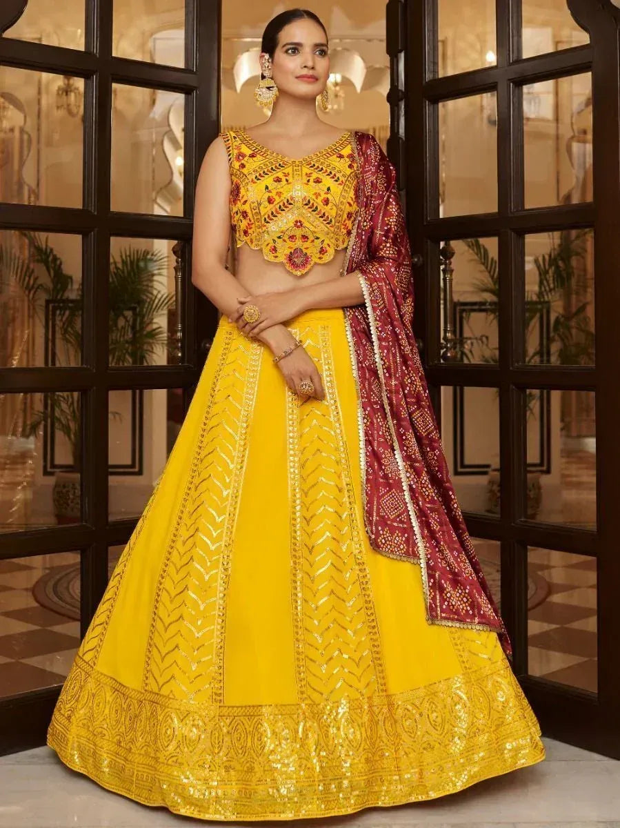 Yellow embroidered lehenga choli with maroon dupatta, perfect for Indian ethnic occasions