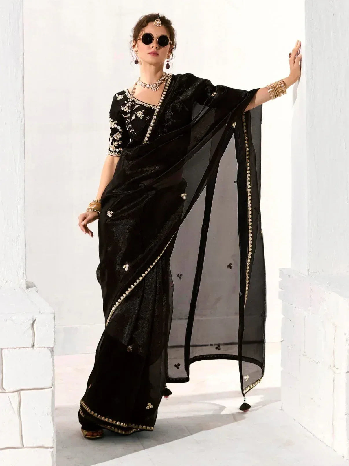 Black embroidered saree with gold detailing, stylish Indian ethnic wear for women