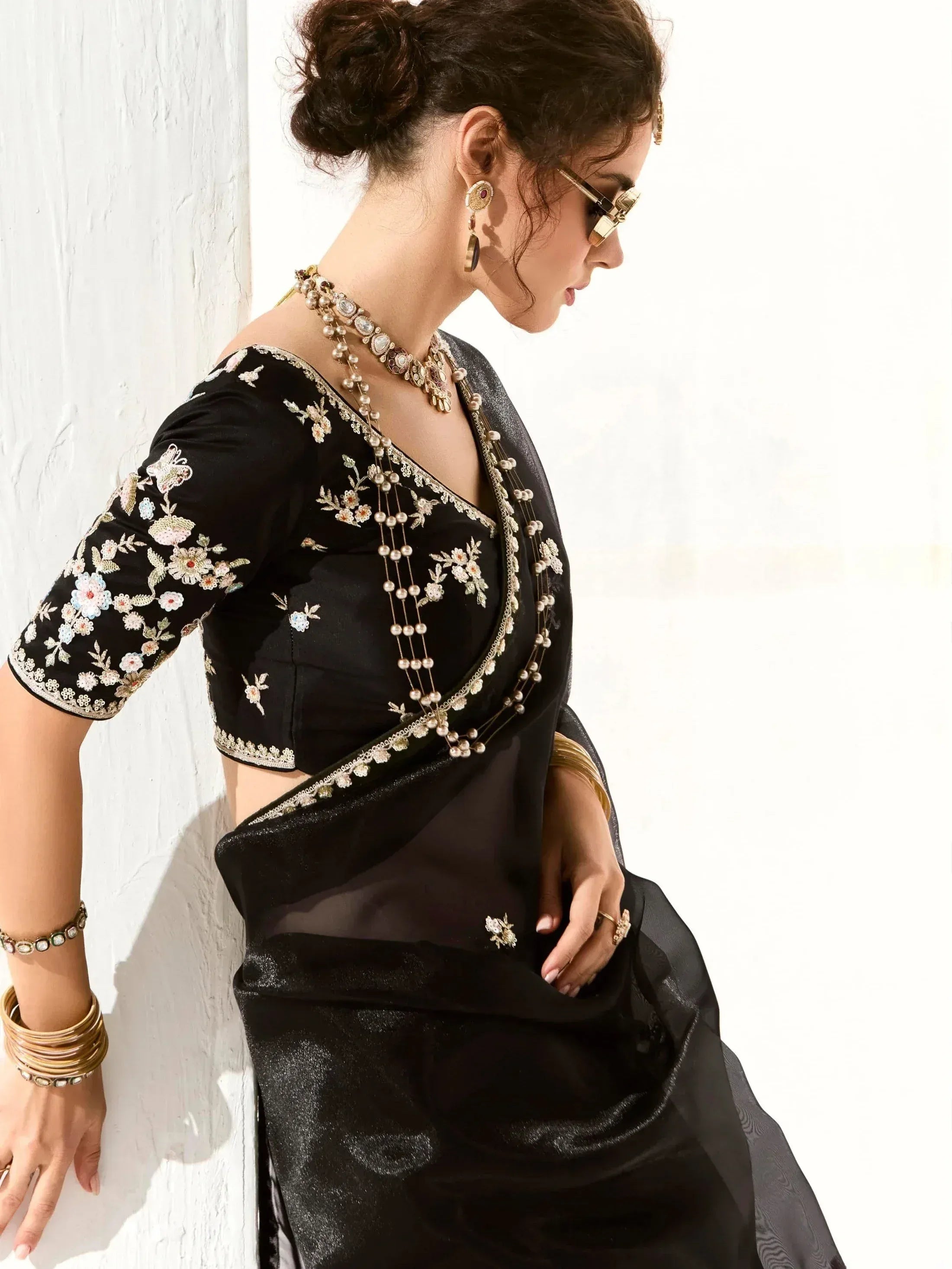Black embroidered saree with floral blouse, perfect for Indian ethnic wear occasions
