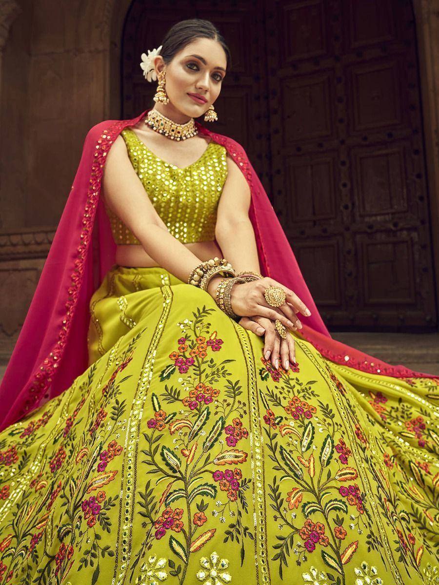 Yellow floral embroidered lehenga choli with pink dupatta, traditional Indian ethnic wear for weddings