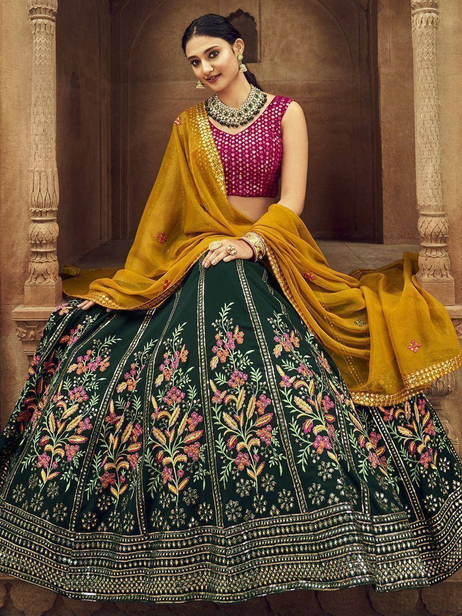 Elegant green floral lehenga choli with maroon blouse and mustard dupatta, perfect for Indian ethnic occasions