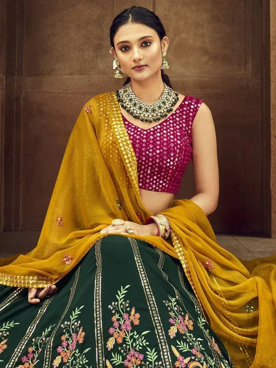 Elegant Indian lehenga choli with floral embroidery, pink blouse, and mustard dupatta for festive occasions