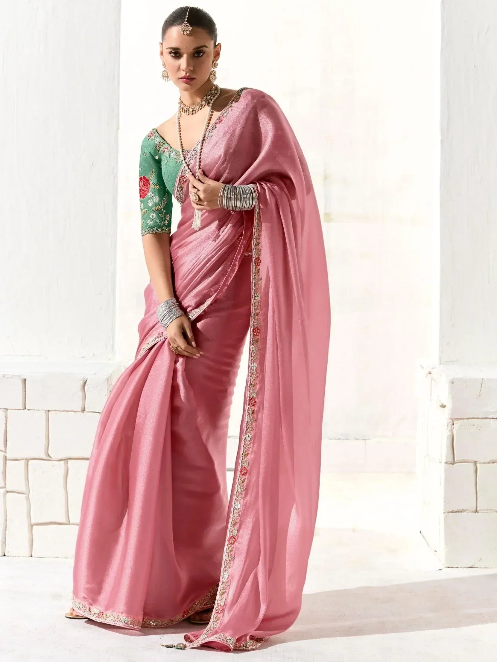 Pink silk saree with floral embroidery, paired with green blouse, perfect for Indian ethnic occasions
