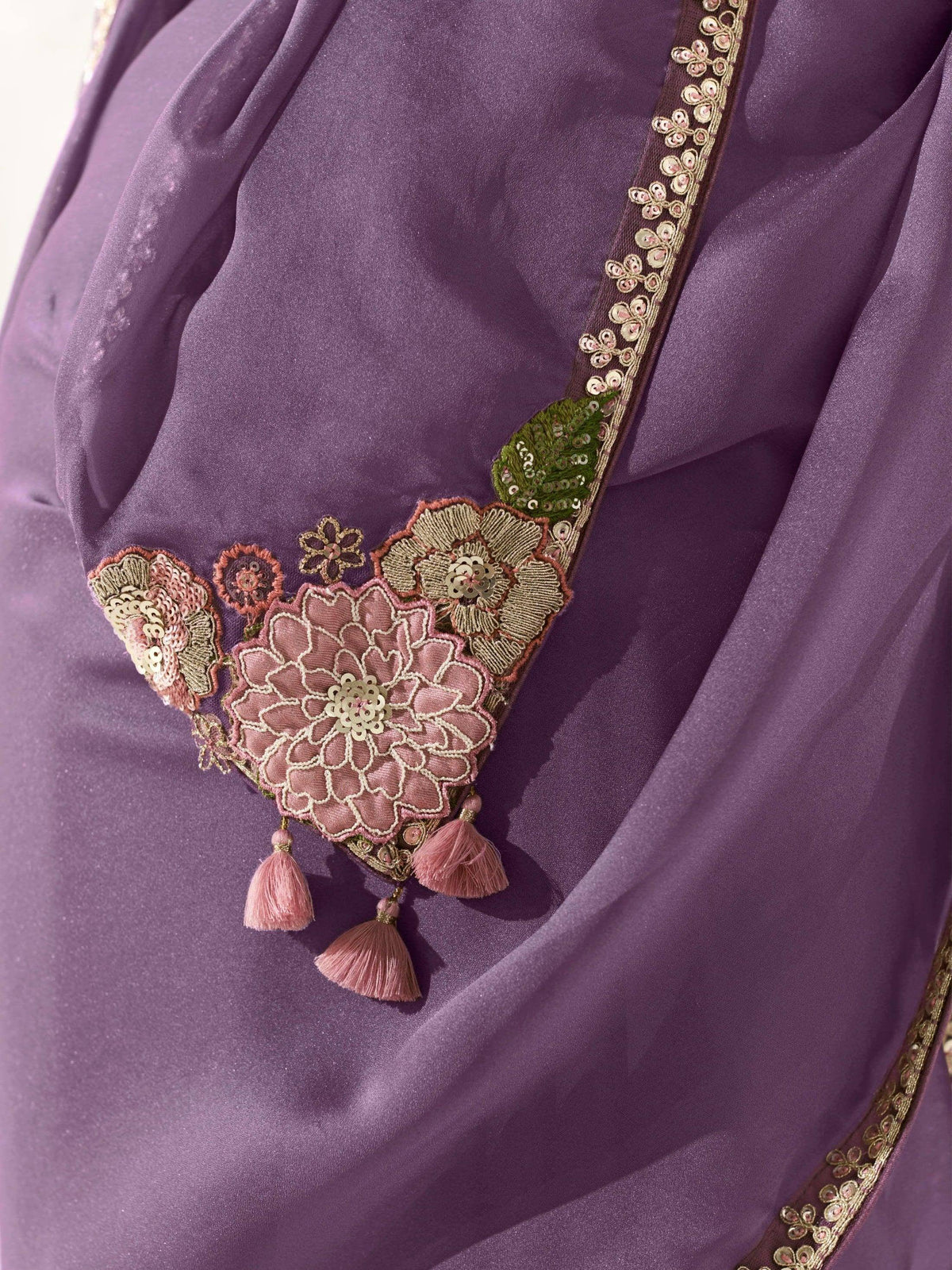 Purple ethnic gown with floral embroidery and tassels, designer Indian wear