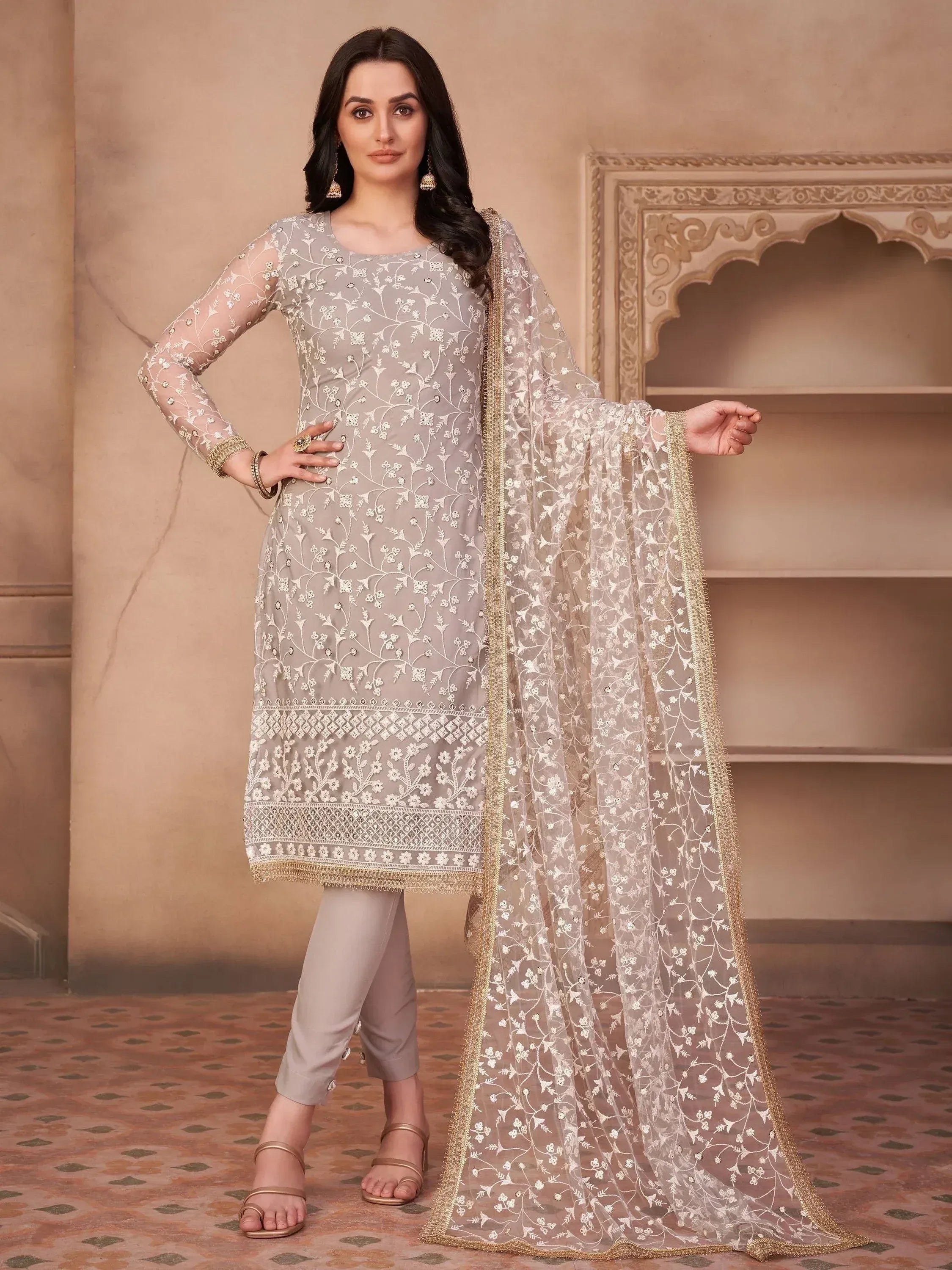 Elegant grey embroidered salwar kameez with sheer dupatta, perfect for Indian ethnic wear occasions.