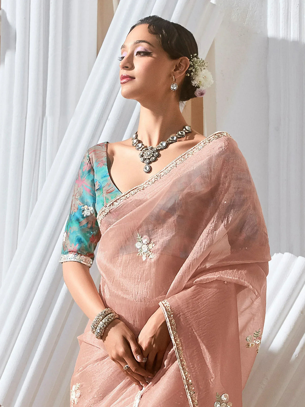 Elegant pink saree with floral embroidery and designer blouse, perfect for Indian ethnic wear