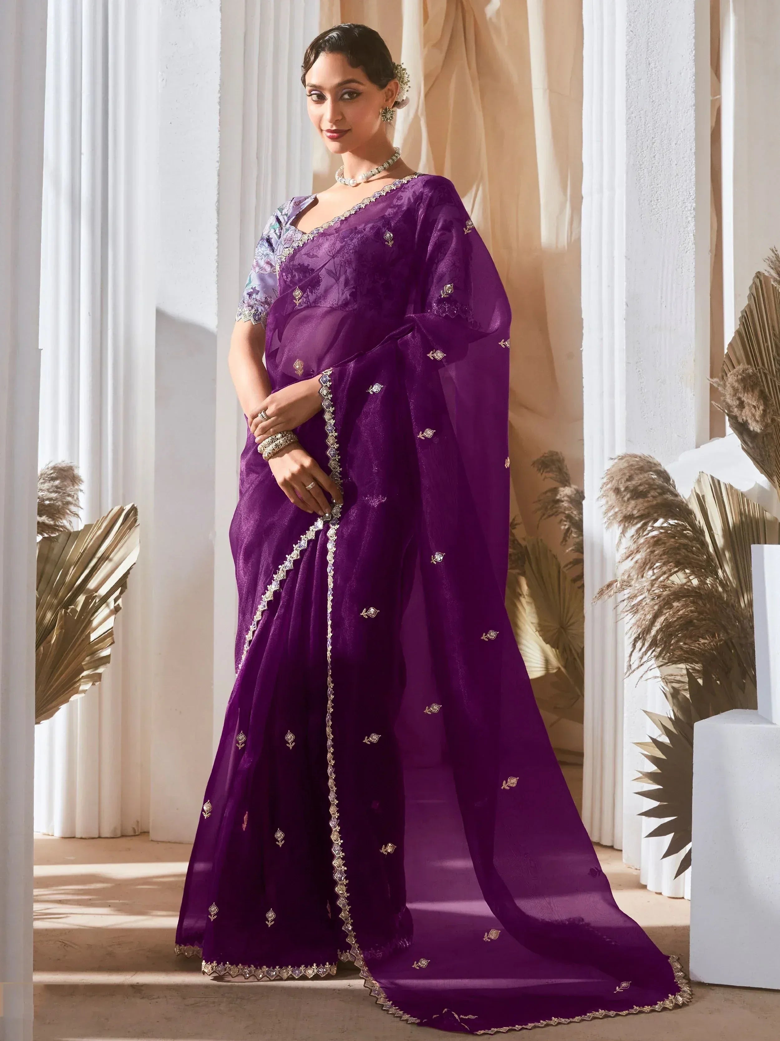 Purple designer saree with gold embroidery and floral blouse, elegant Indian ethnic wear