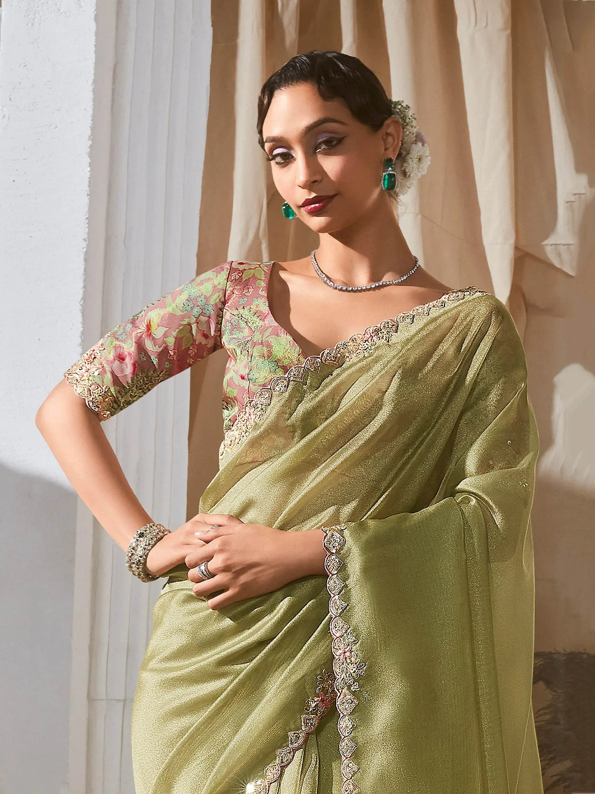 Elegant olive green saree with floral blouse, perfect for Indian ethnic wear occasions