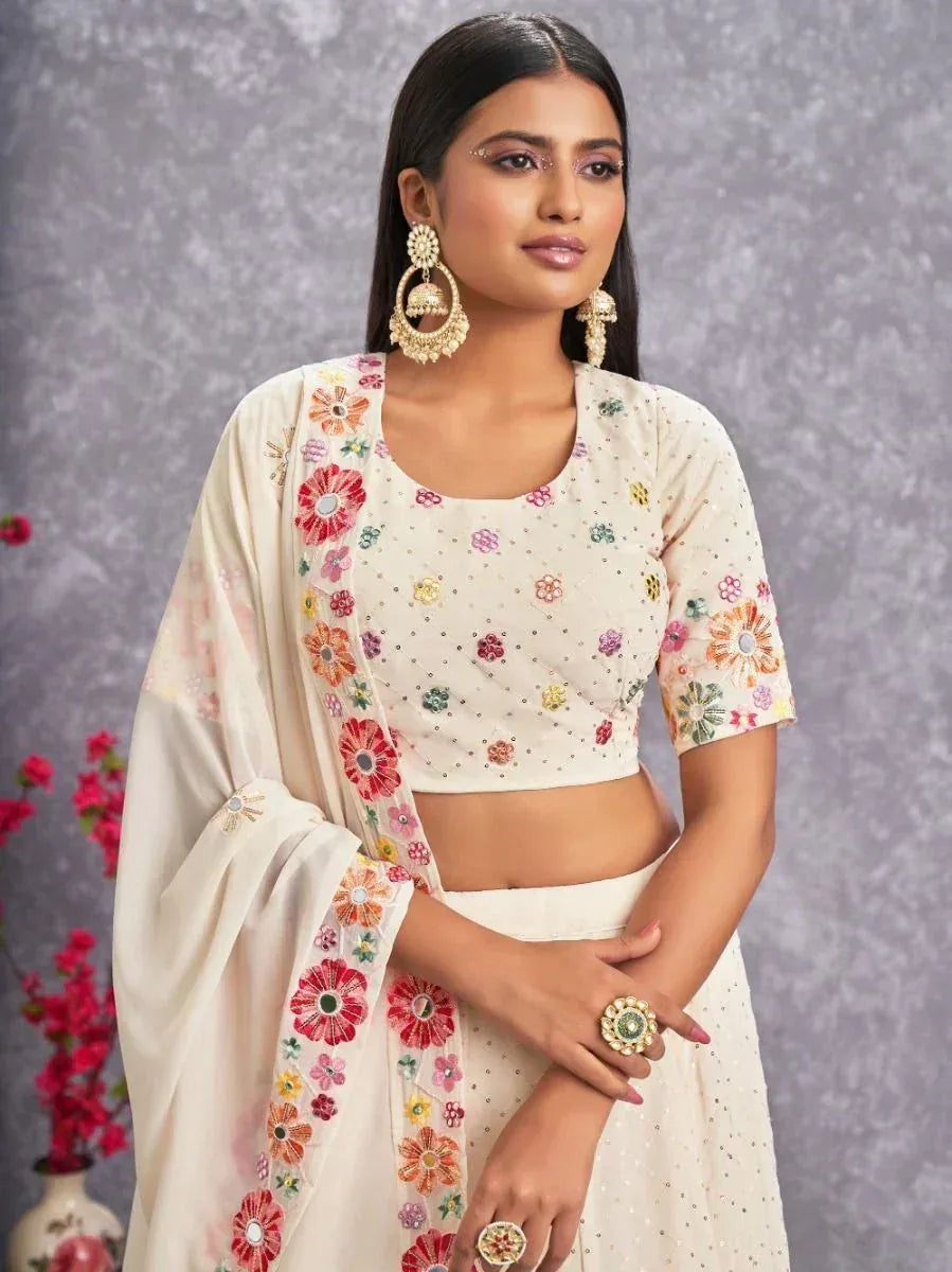 Cream floral embroidered lehenga choli with mirror work, perfect for Indian ethnic occasions