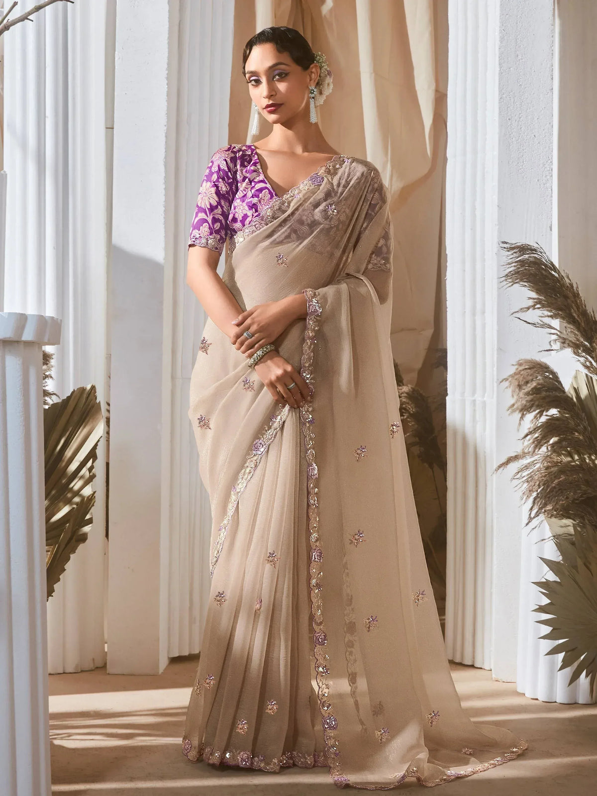 Elegant beige saree with purple floral blouse, perfect for Indian ethnic wear occasions