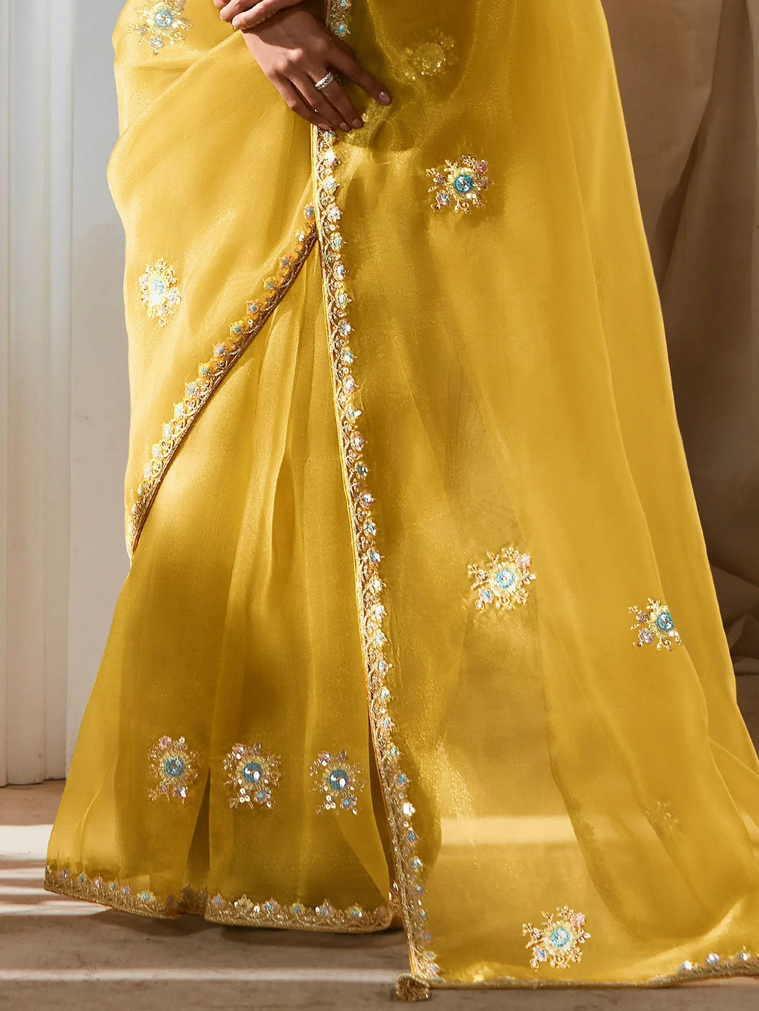 Yellow designer saree with floral embroidery and sequin work, perfect for Indian ethnic wear occasions
