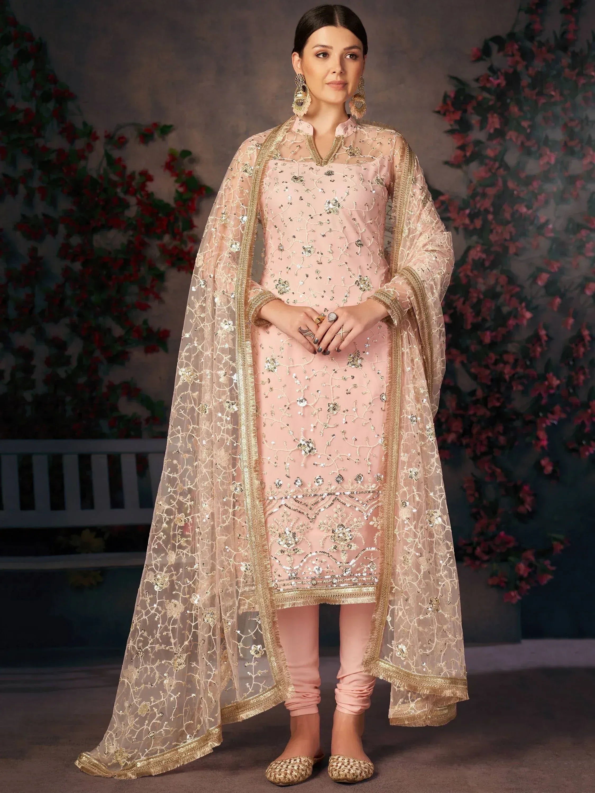 Pink embroidered salwar kameez with gold detailing and sheer dupatta, ideal for Indian ethnic occasions