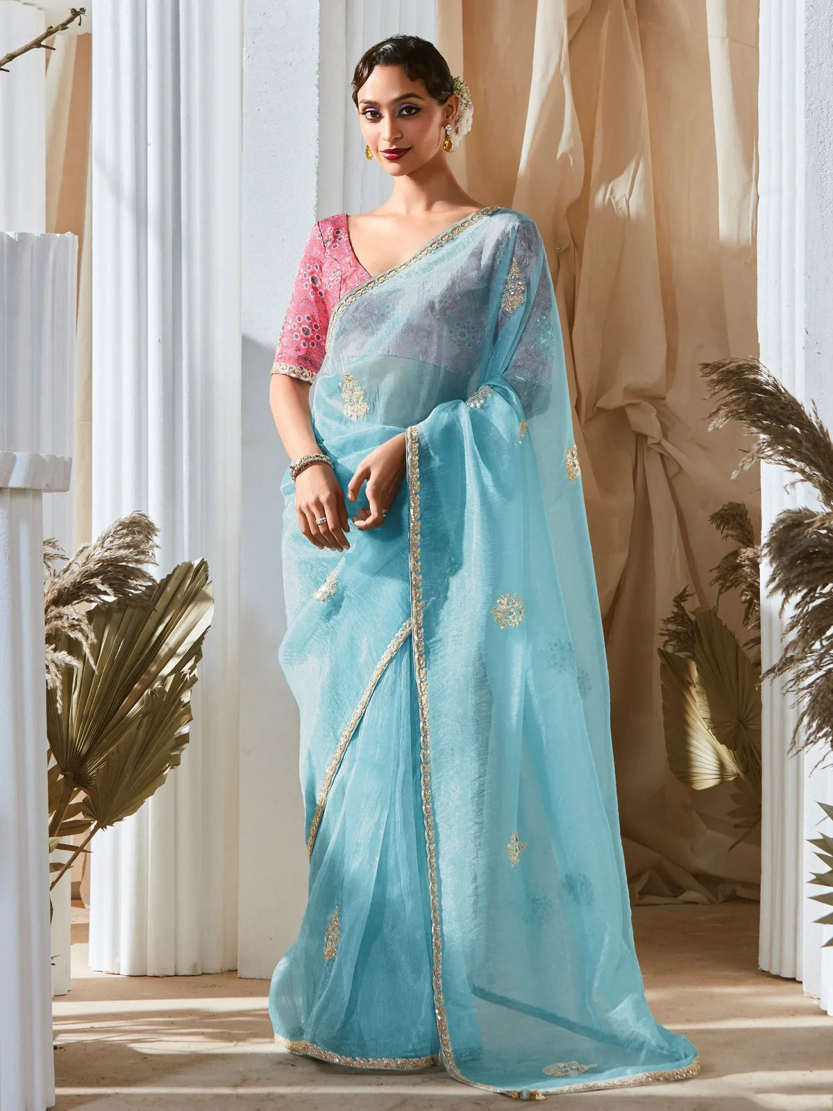 Light blue embroidered saree with pink blouse, gold detailing, perfect for Indian ethnic occasions