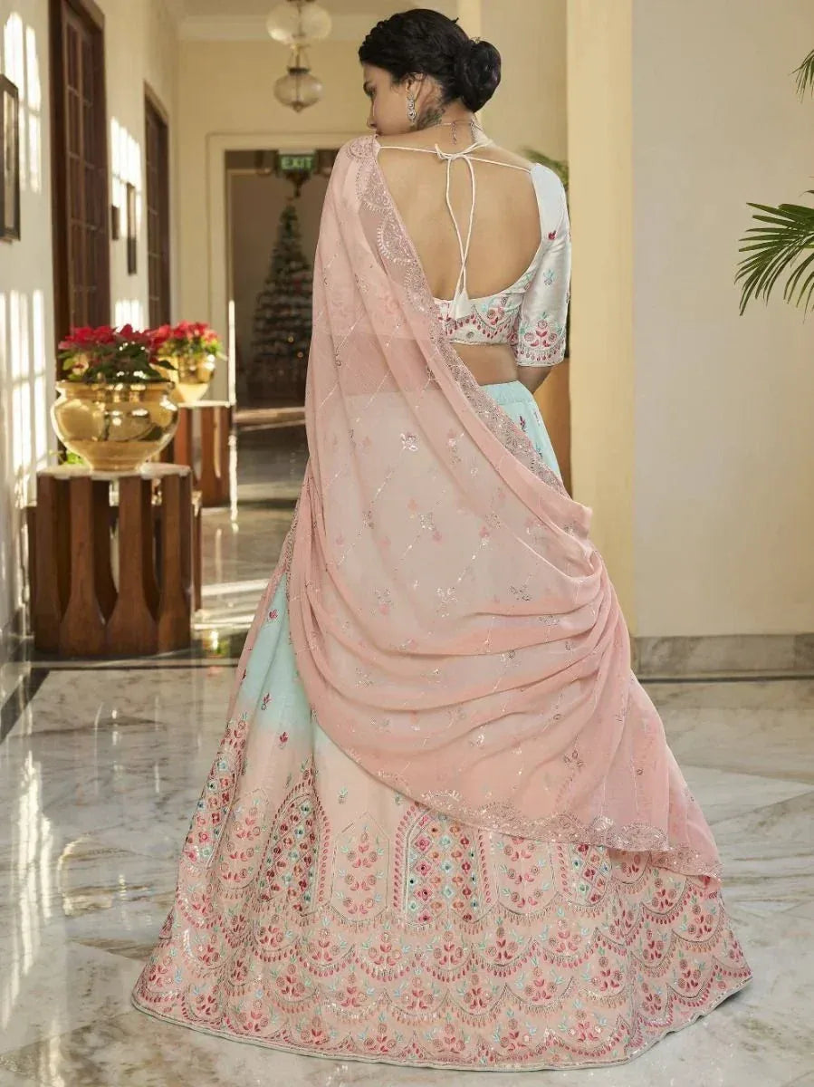 Pink and mint embroidered lehenga choli with back tie blouse and sheer dupatta, ideal for Indian ethnic occasions