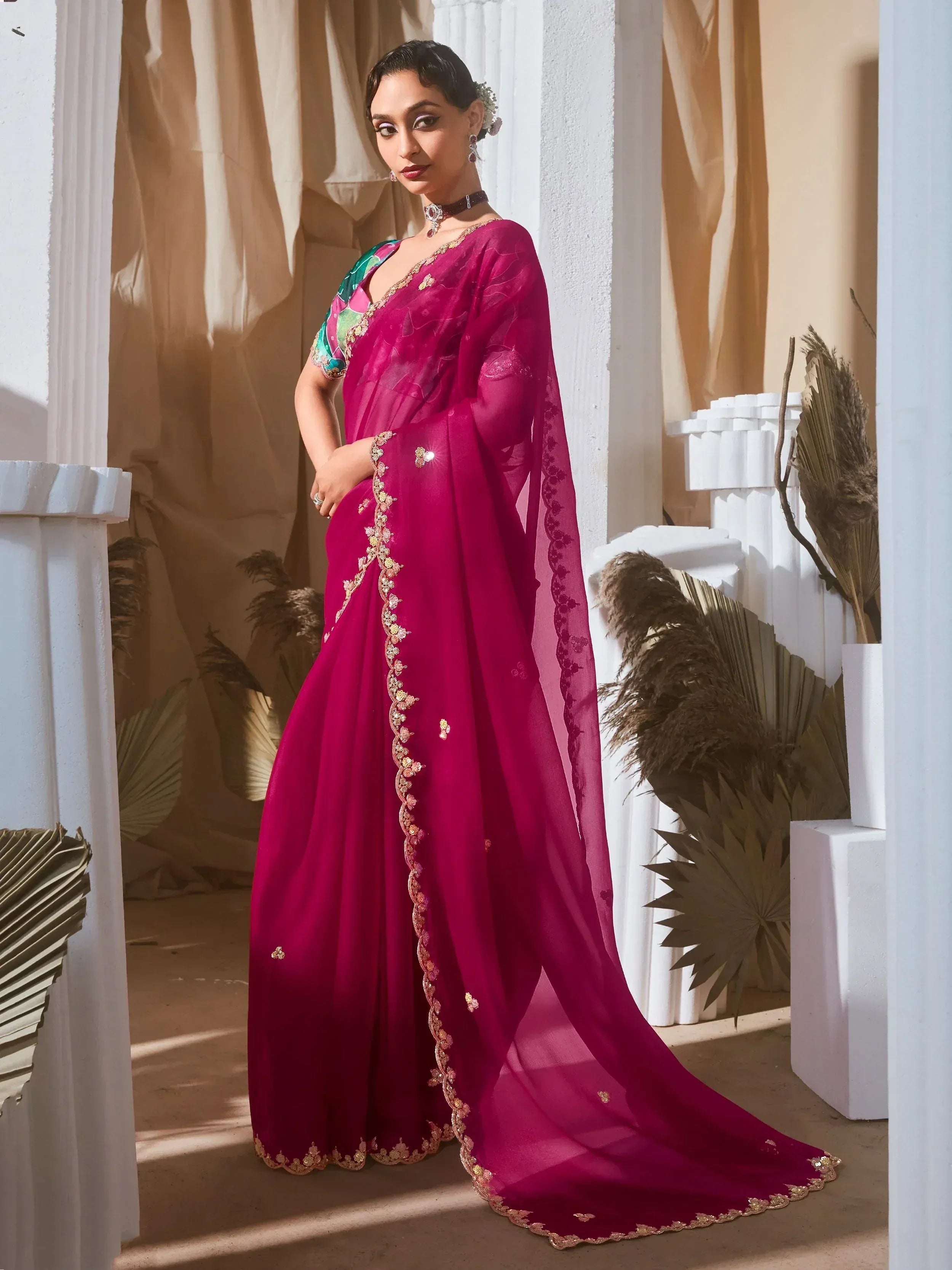 Elegant magenta saree with gold embroidery and floral blouse, perfect for Indian ethnic occasions