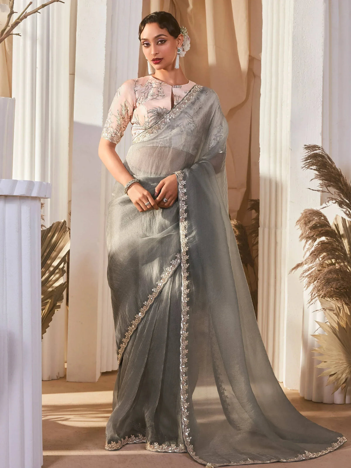 Elegant grey saree with floral embroidery and sequin border, paired with a blush blouse for Indian ethnic wear