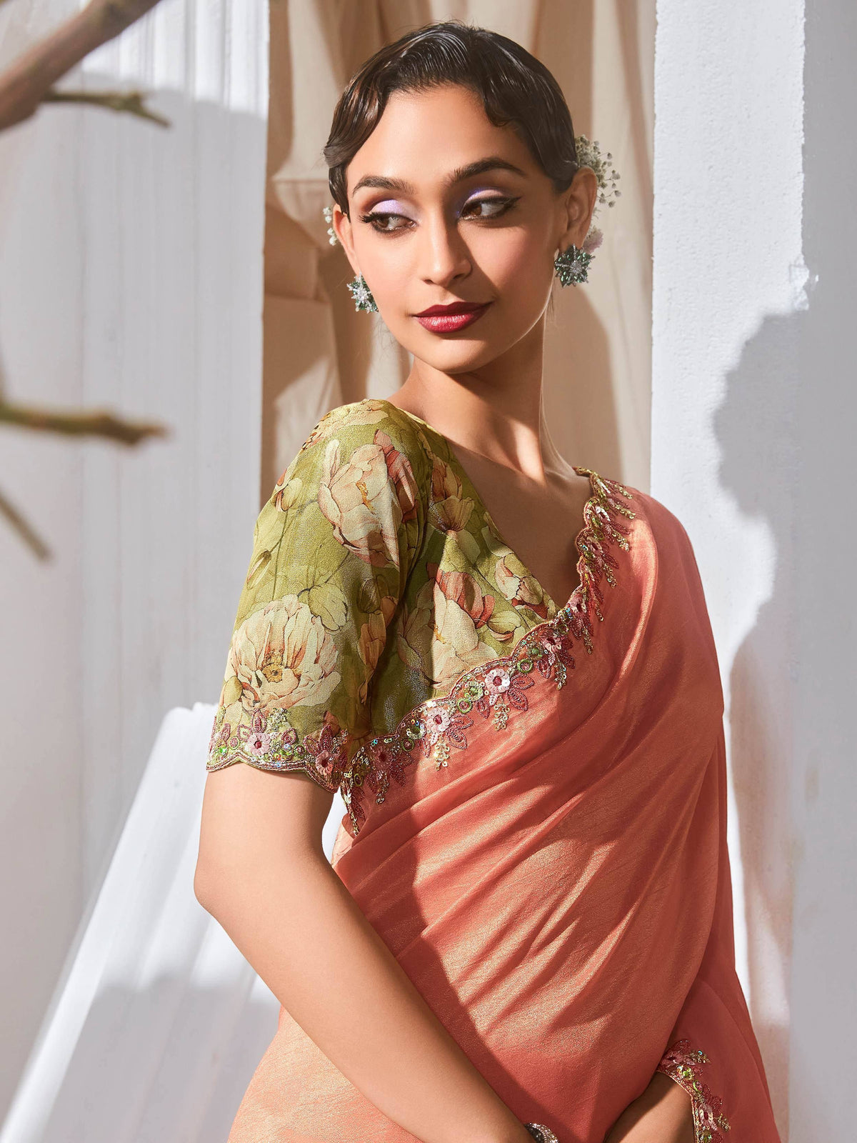 Elegant peach saree with floral blouse and sequin embroidery, perfect for Indian ethnic occasions.