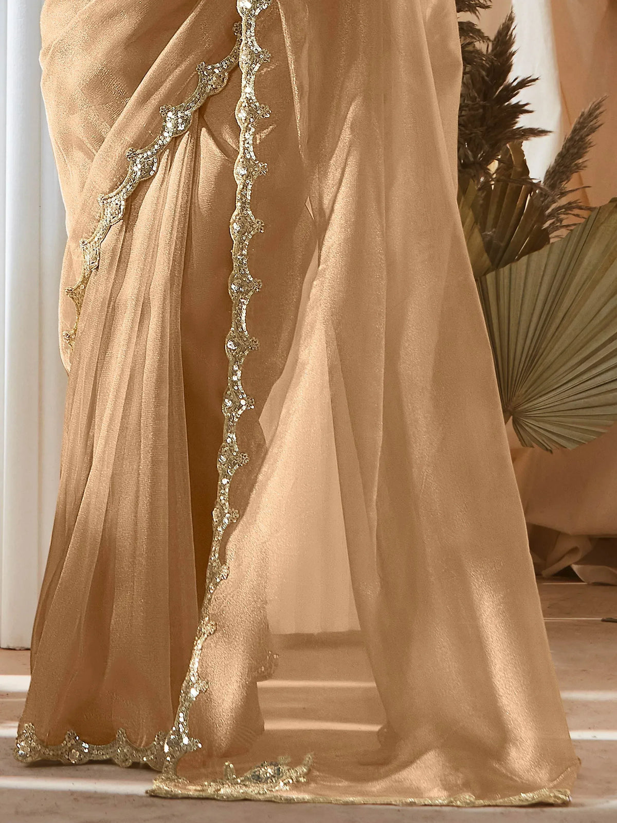 Gold embroidered ethnic gown with sequin detailing, perfect for Indian weddings and festive occasions