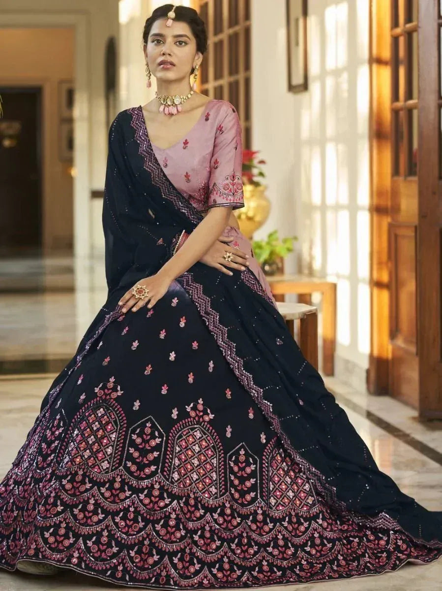 Elegant navy blue lehenga choli with pink floral embroidery, perfect for Indian ethnic occasions