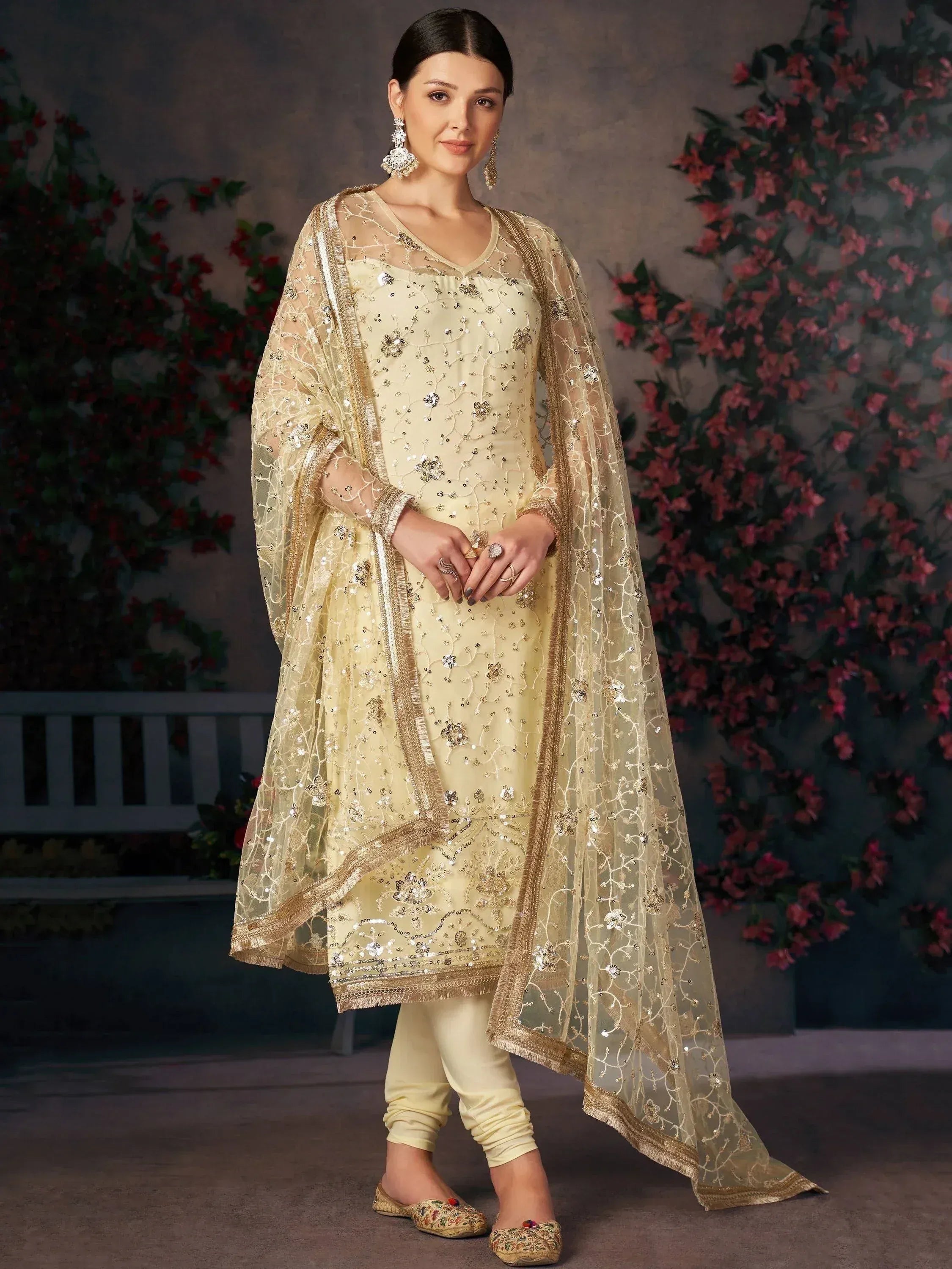 Elegant cream salwar kameez with gold embroidery and sheer dupatta, perfect for Indian ethnic occasions