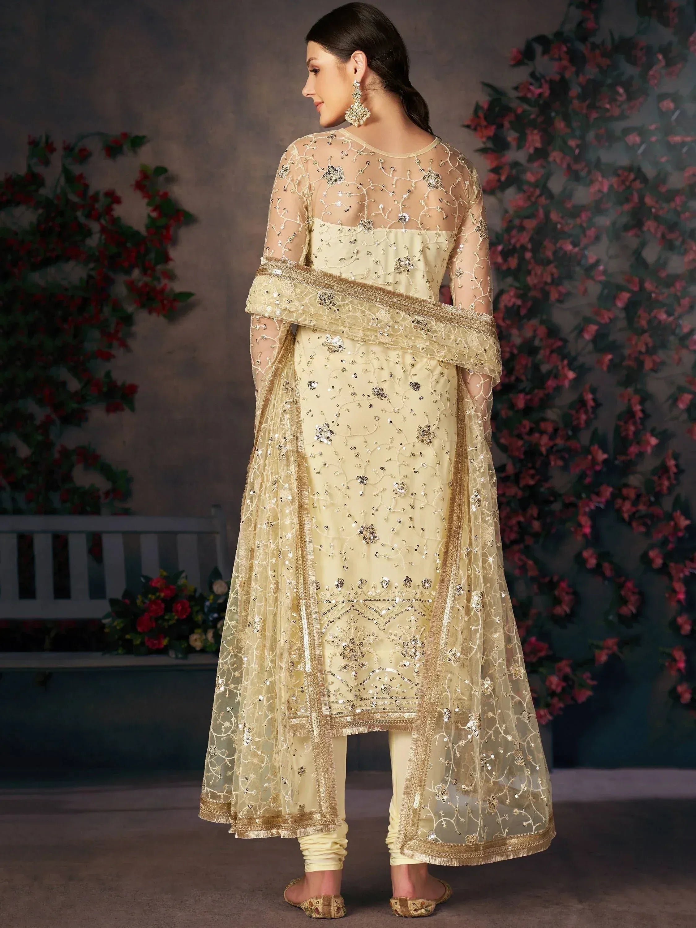 Elegant cream salwar kameez with gold embroidery and sheer dupatta, perfect for Indian ethnic occasions