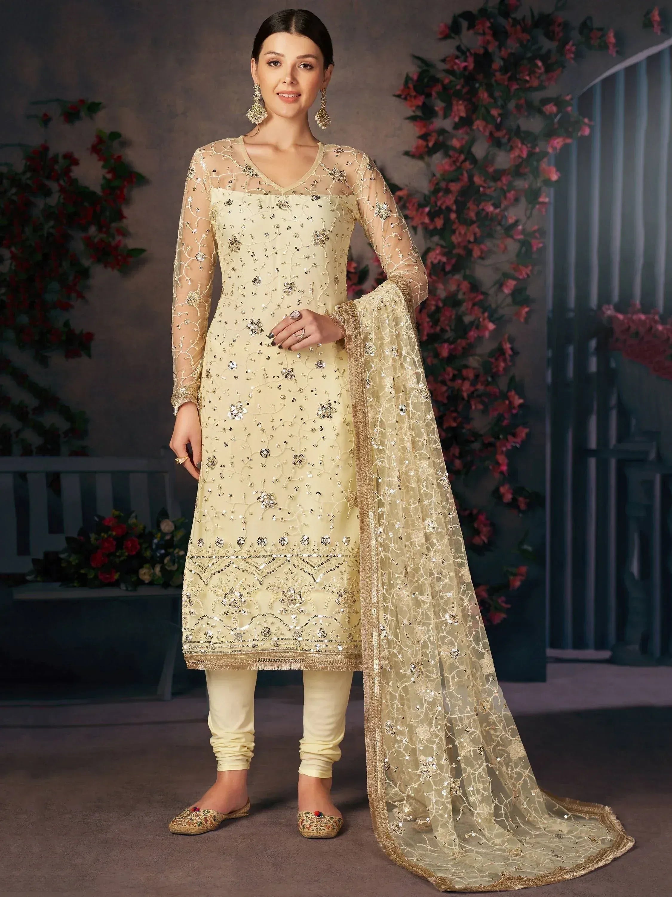 Elegant cream salwar kameez with sequin embroidery, sheer sleeves, and matching dupatta for Indian ethnic wear