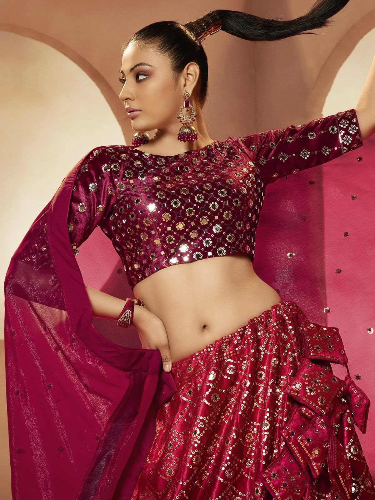 Elegant maroon lehenga choli with mirror work and sequins, perfect for Indian ethnic wear occasions.