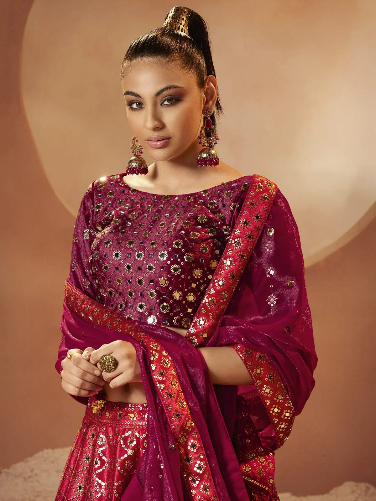 Elegant maroon lehenga choli with mirror work, perfect for Indian ethnic wear and festive occasions.