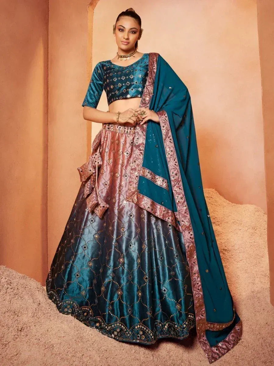 Teal and rose gold designer lehenga choli with intricate embroidery and matching dupatta, perfect for Indian ethnic occasions