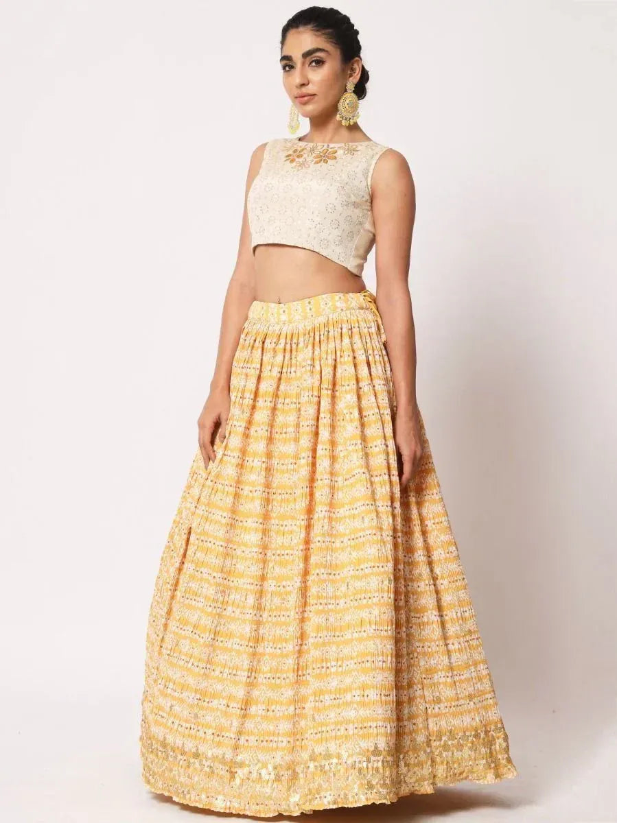 Yellow printed lehenga with embroidered white crop top, ethnic Indian wear