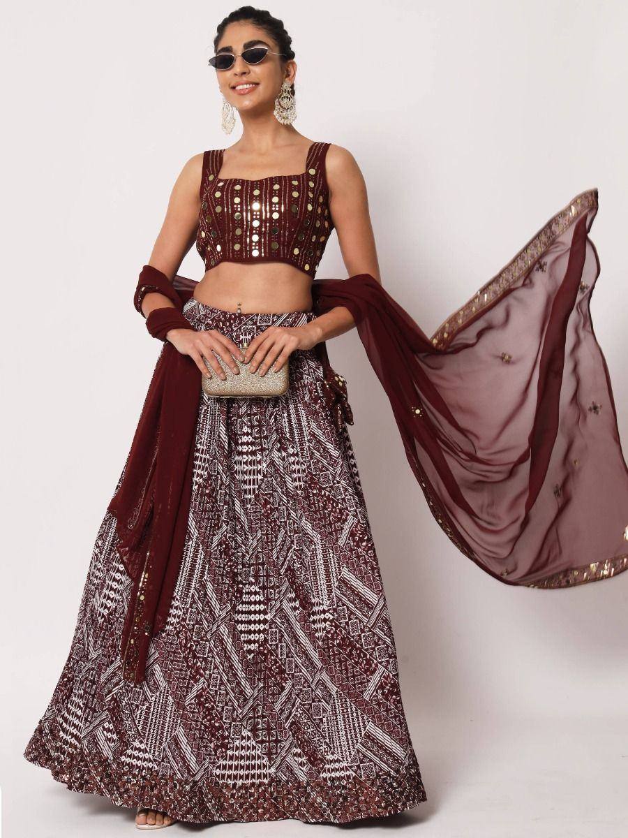 Maroon designer lehenga choli with geometric print, mirror work, and sheer dupatta for Indian ethnic wear