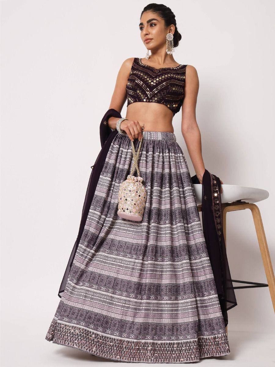Elegant purple lehenga choli with intricate embroidery, perfect for Indian ethnic wear occasions.