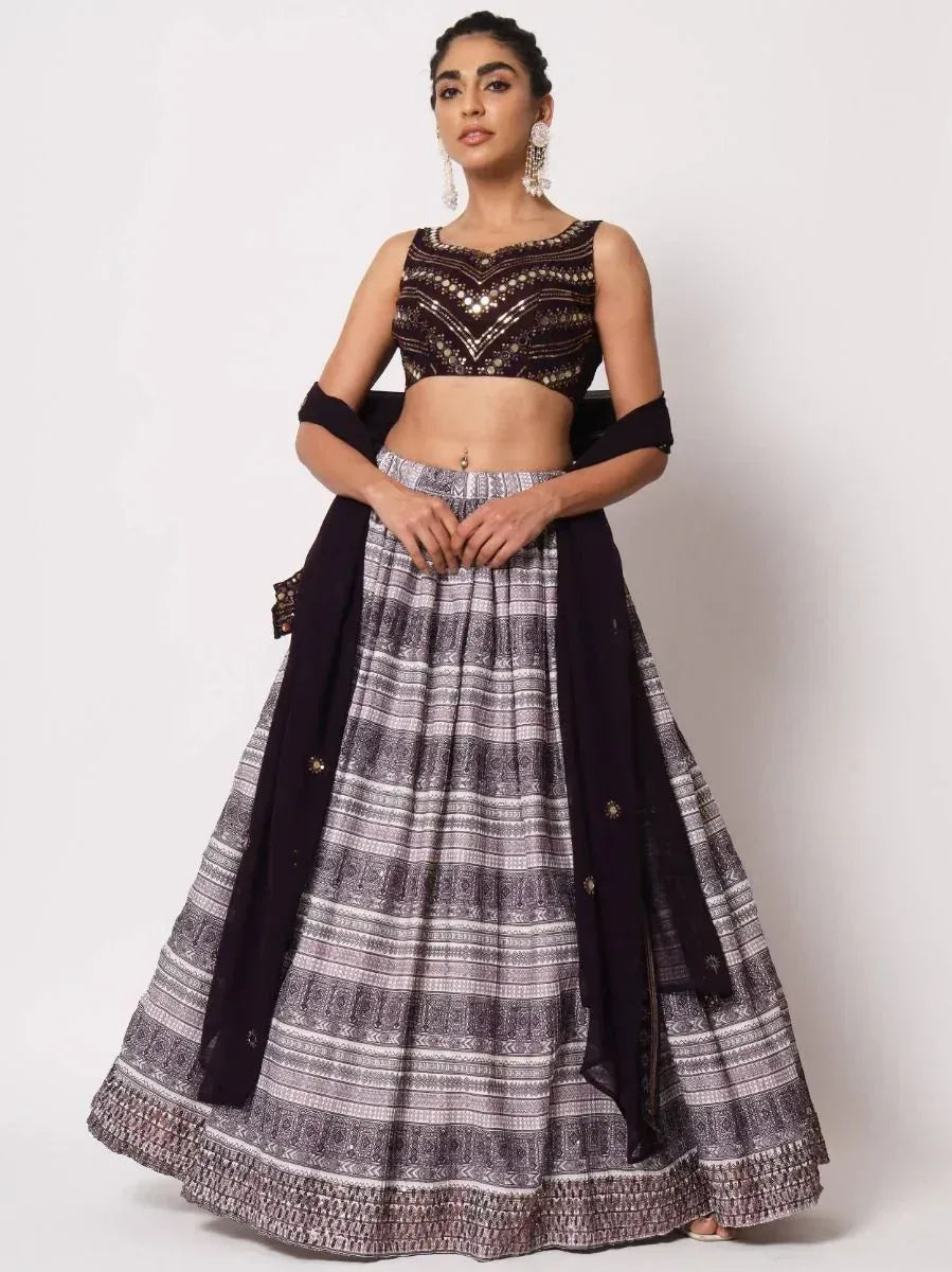 Black and silver embroidered lehenga choli with patterned skirt and dupatta, perfect for Indian ethnic occasions