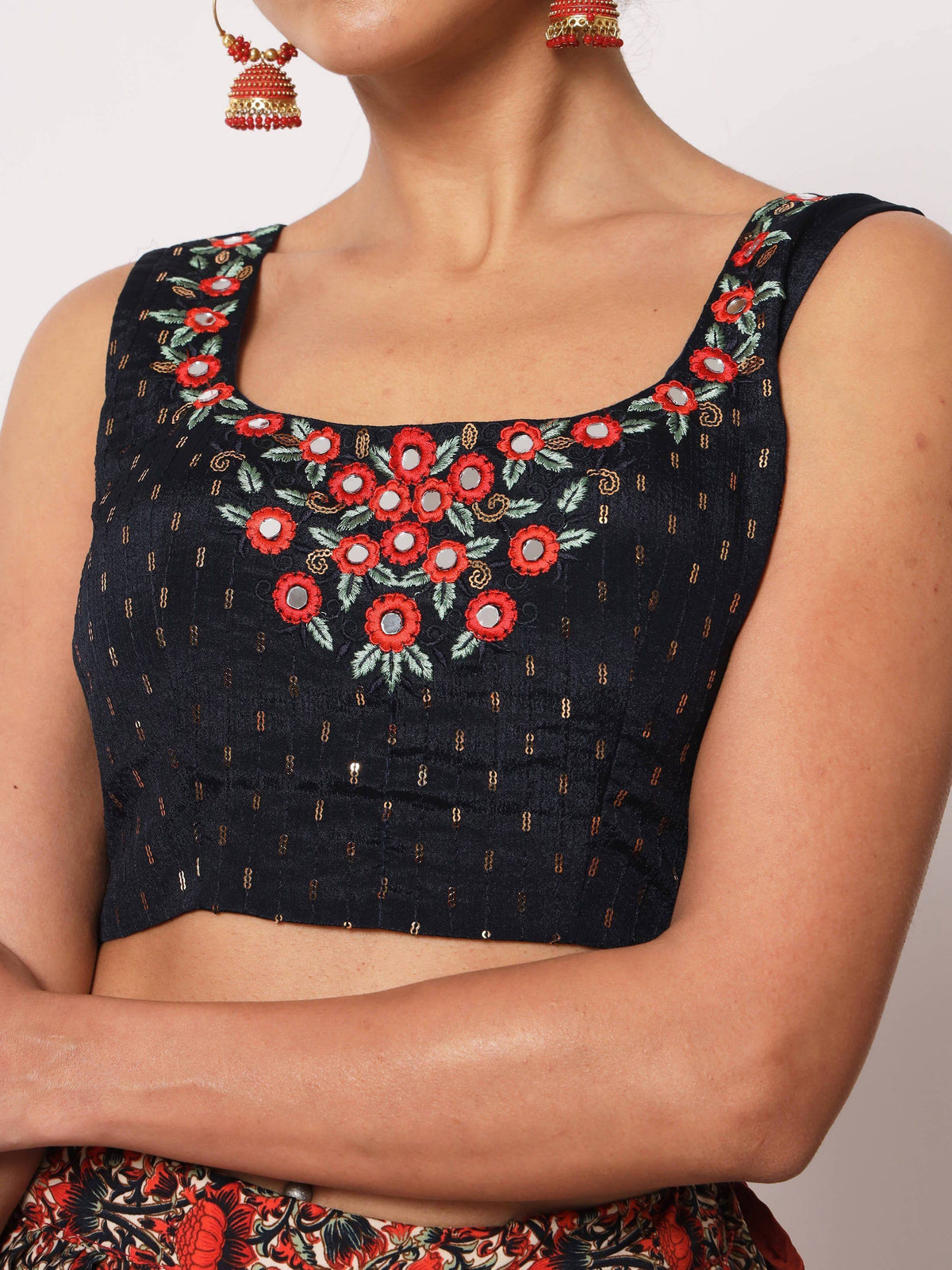 Black embroidered crop top with red floral mirror work, gold detailing, and square neckline for ethnic wear