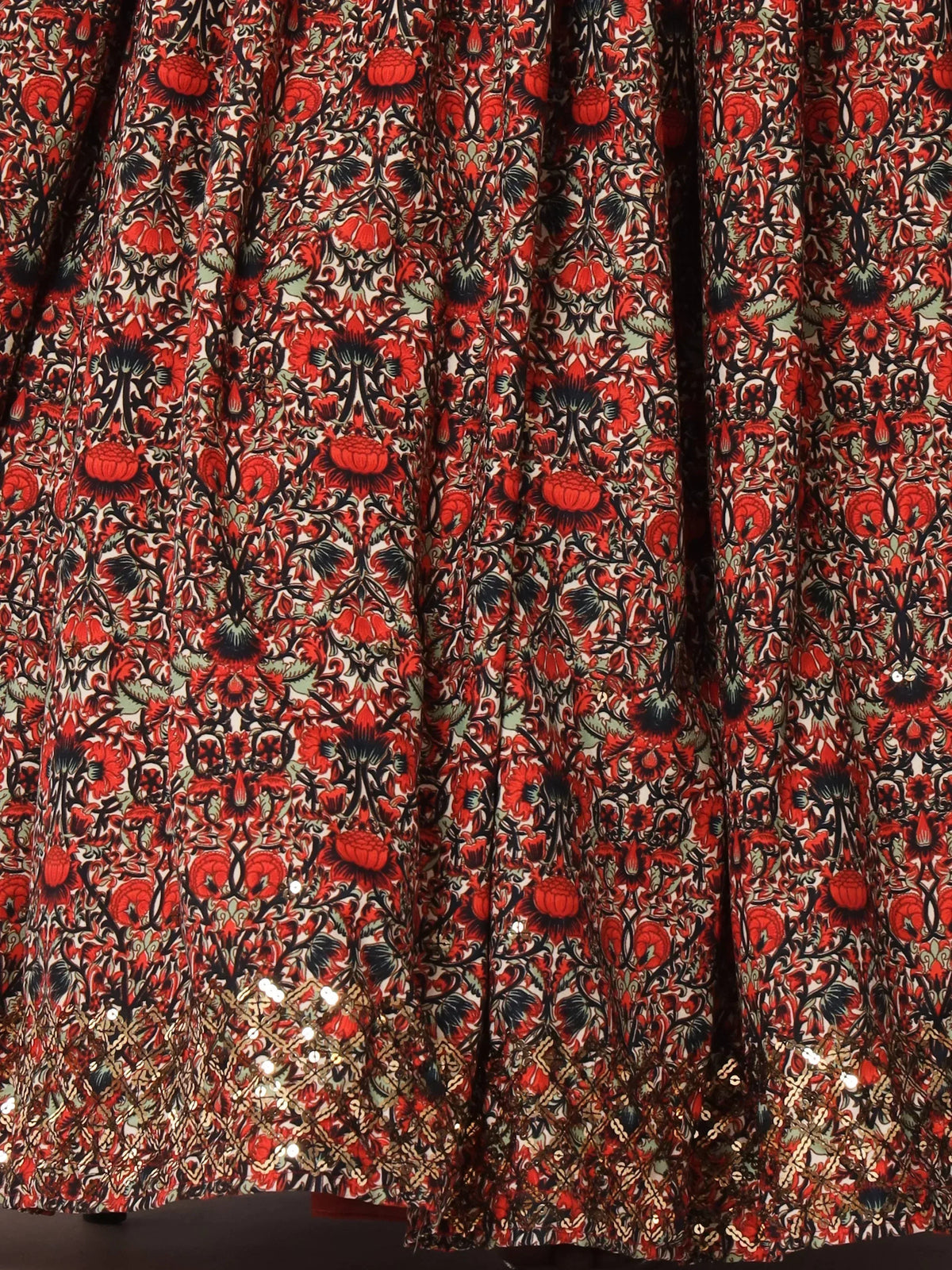 Red floral print ethnic gown with sequin border, perfect for festive occasions and traditional events.
