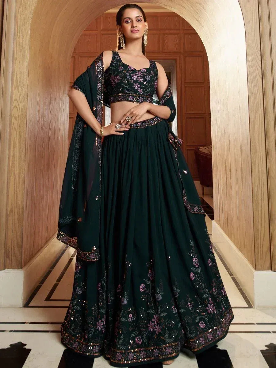 Dark green embroidered lehenga choli with floral motifs and sheer dupatta, perfect for Indian ethnic occasions