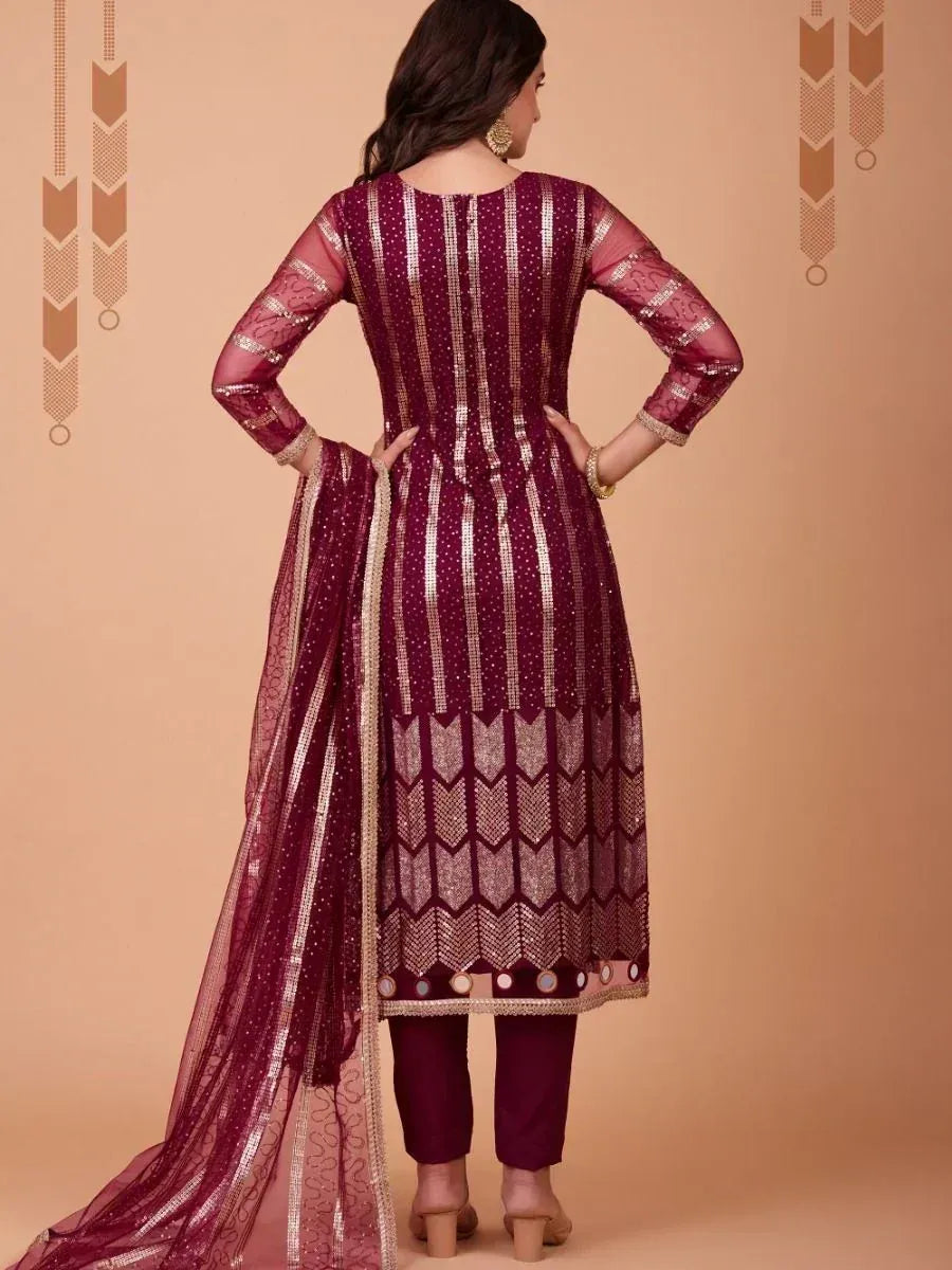 Maroon ethnic salwar kameez with gold embroidery and sheer dupatta, back view