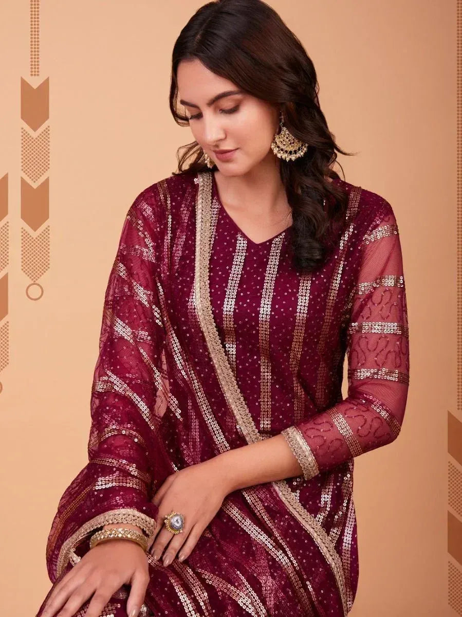 Elegant maroon sequin ethnic gown with gold embroidery, perfect for Indian festive occasions