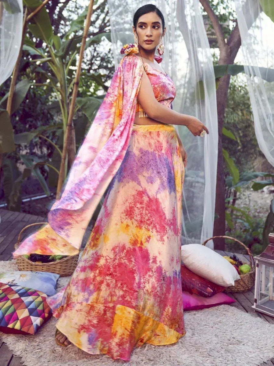 Vibrant tie-dye lehenga choli with floral dupatta, perfect for ethnic occasions and festive wear.
