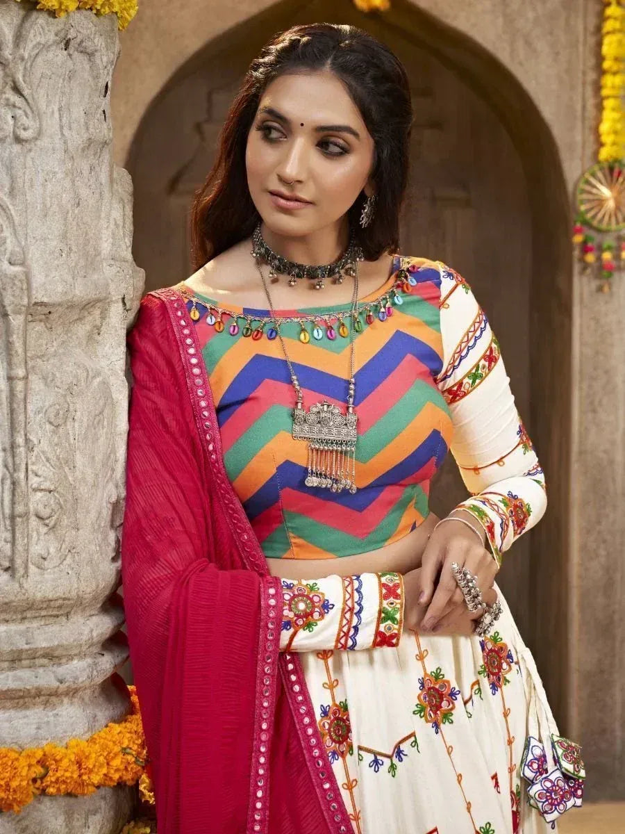 Colorful ethnic lehenga choli with chevron top, embroidered skirt, and pink dupatta for Indian wear