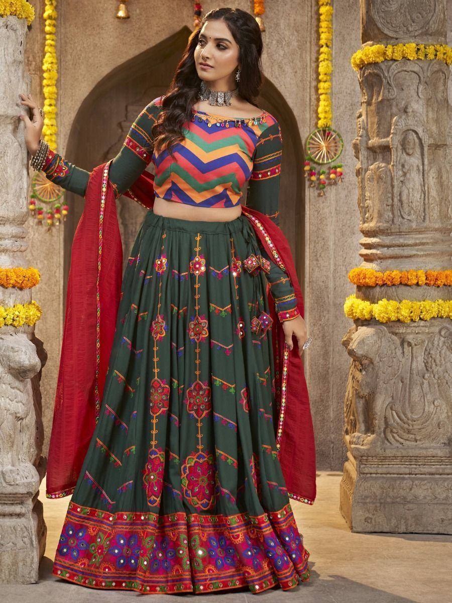 Green embroidered lehenga choli with colorful zigzag blouse and red dupatta, traditional Indian ethnic wear
