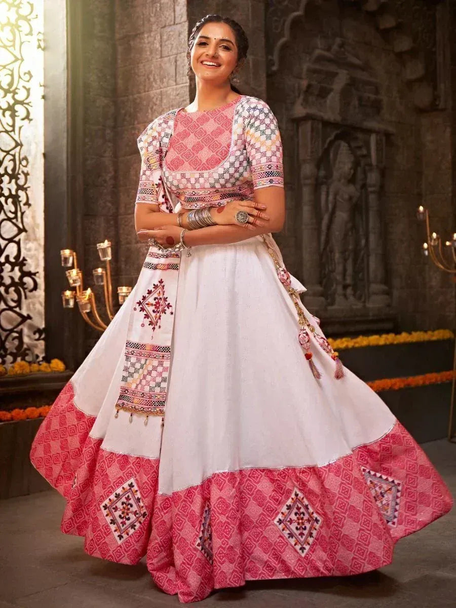 Pink and white embroidered lehenga choli with geometric patterns, perfect for Indian ethnic occasions