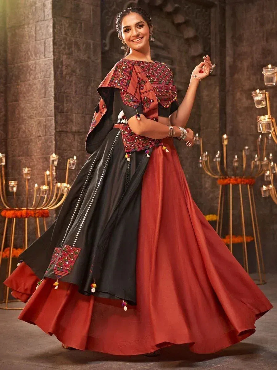 Woman in red and black embroidered lehenga choli with dupatta, festive Indian ethnic wear
