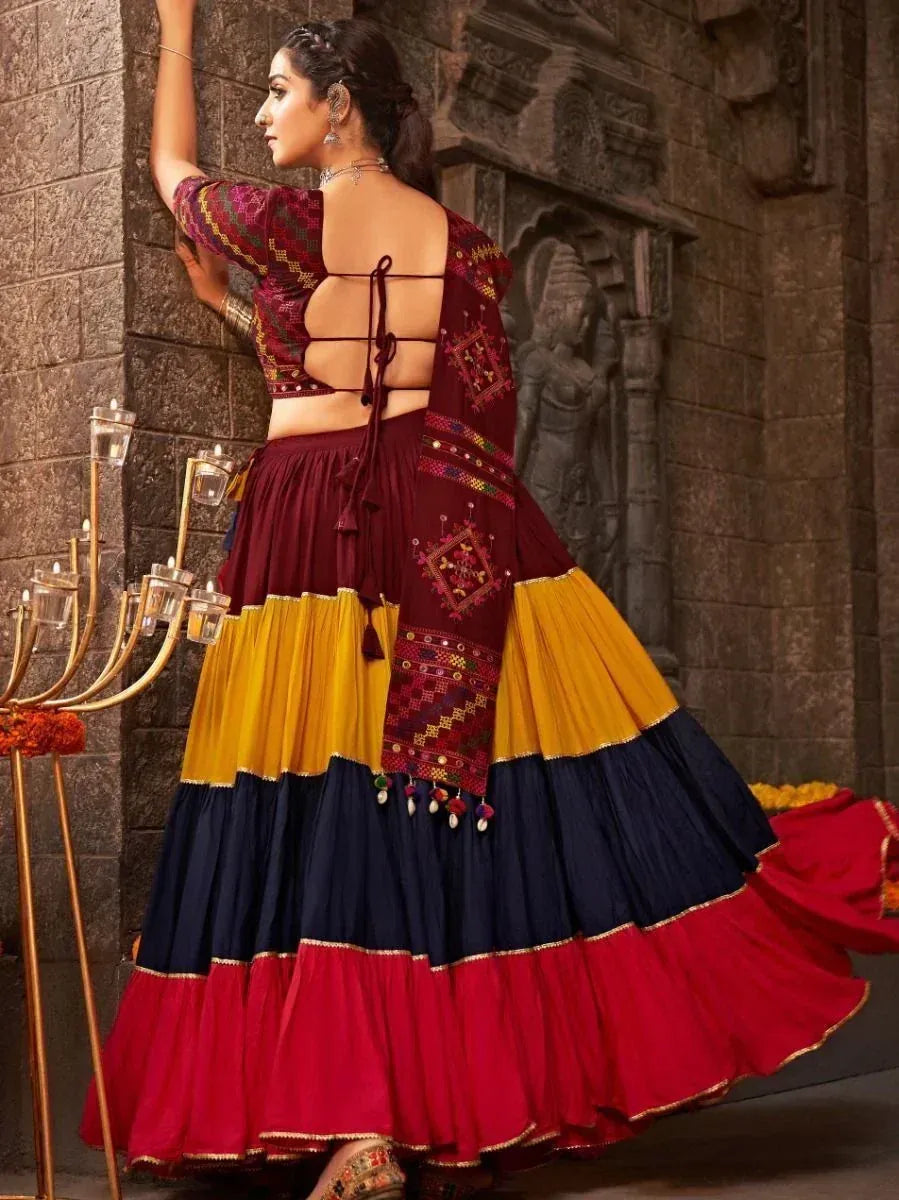 Maroon, yellow, and navy blue embroidered lehenga choli with back tie detail, perfect for Indian ethnic wear