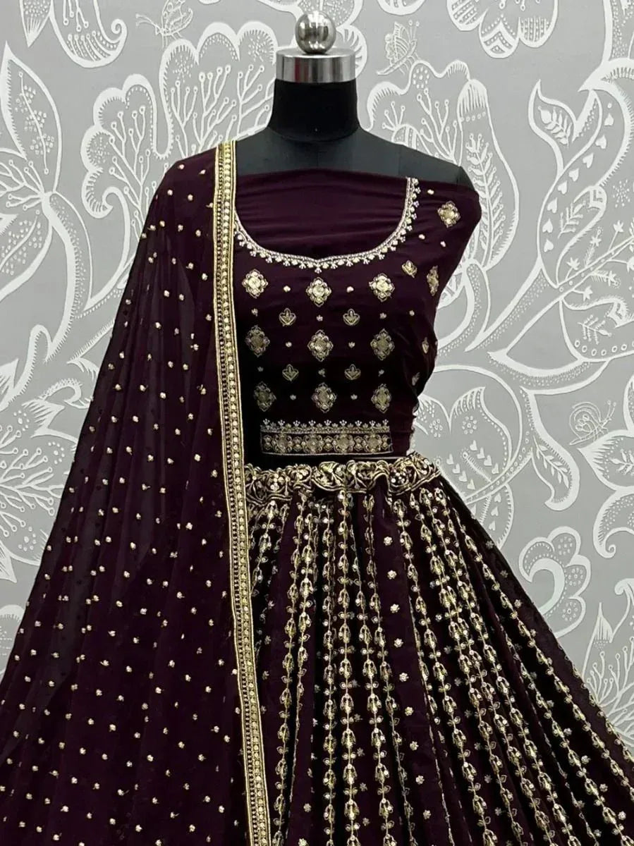 Elegant maroon lehenga choli with gold embroidery and embellished dupatta for Indian ethnic wear