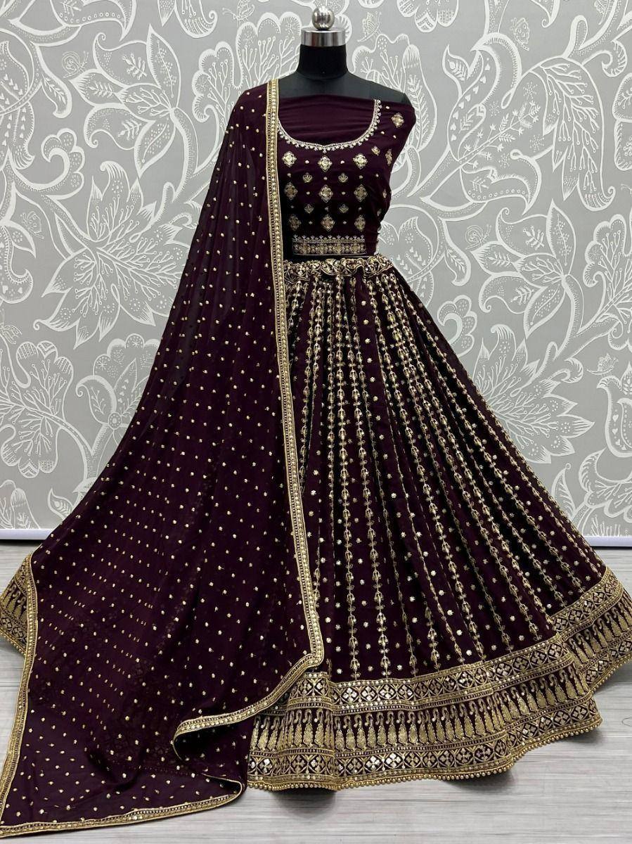 Elegant maroon lehenga choli with gold embroidery and dupatta, perfect for Indian ethnic wear occasions
