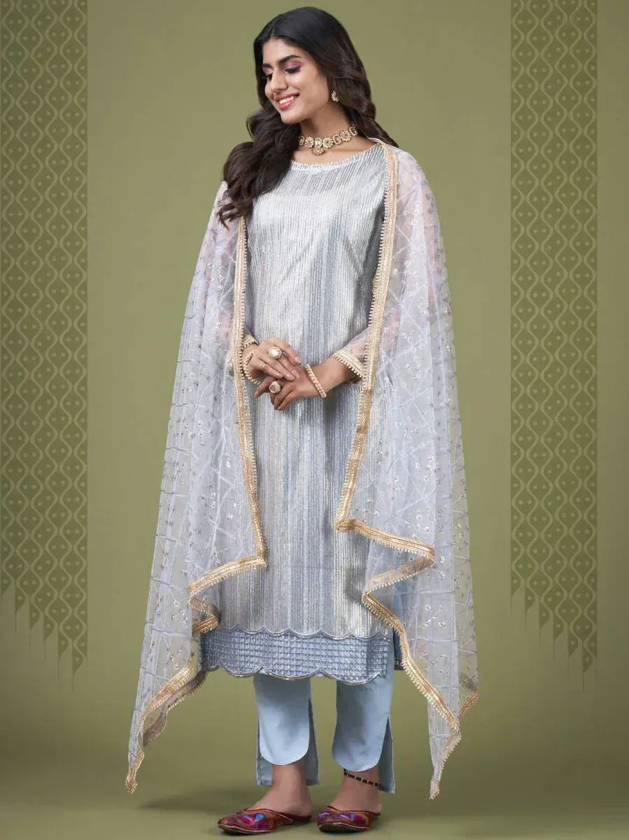 Elegant silver striped kurta with gold trim, paired with light blue pants and sheer dupatta for ethnic wear
