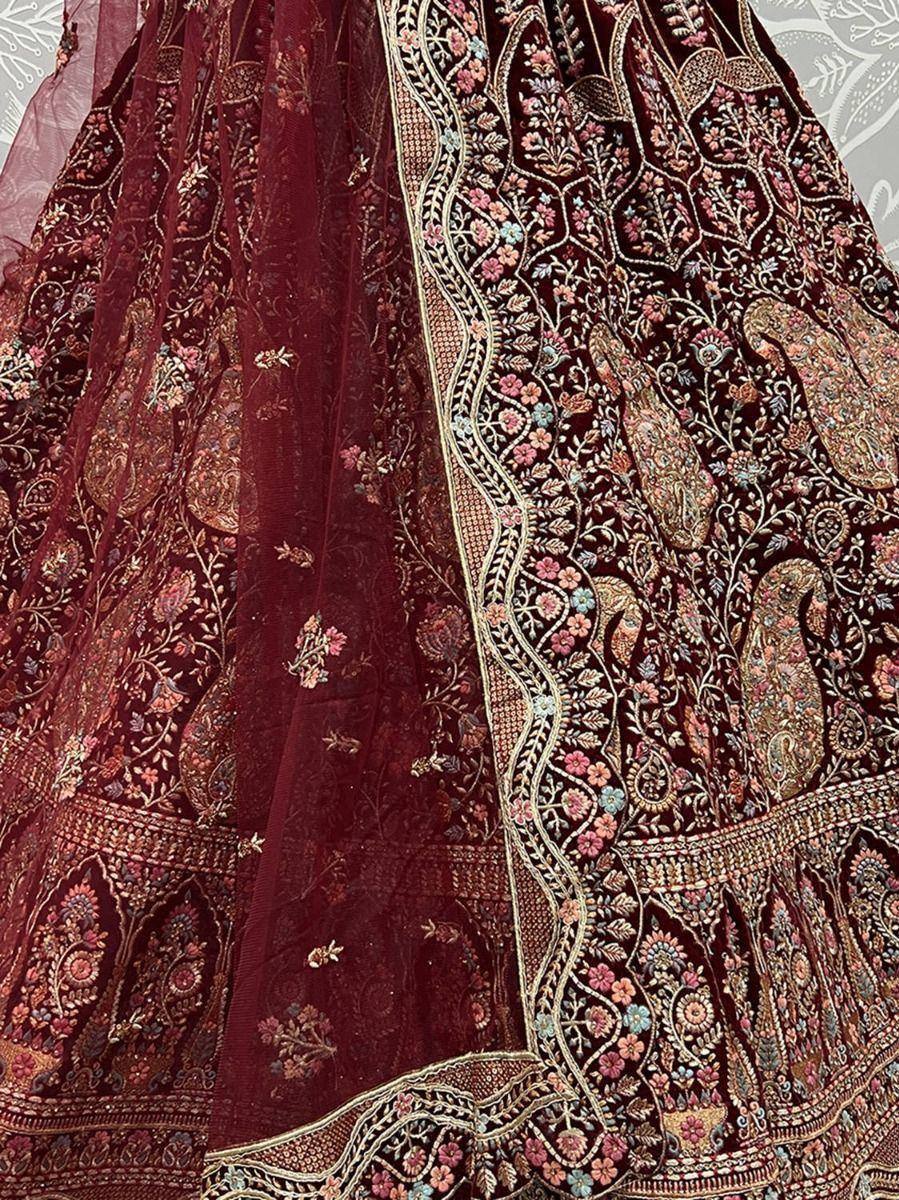 Maroon embroidered lehenga with floral and paisley motifs, perfect for Indian ethnic wear