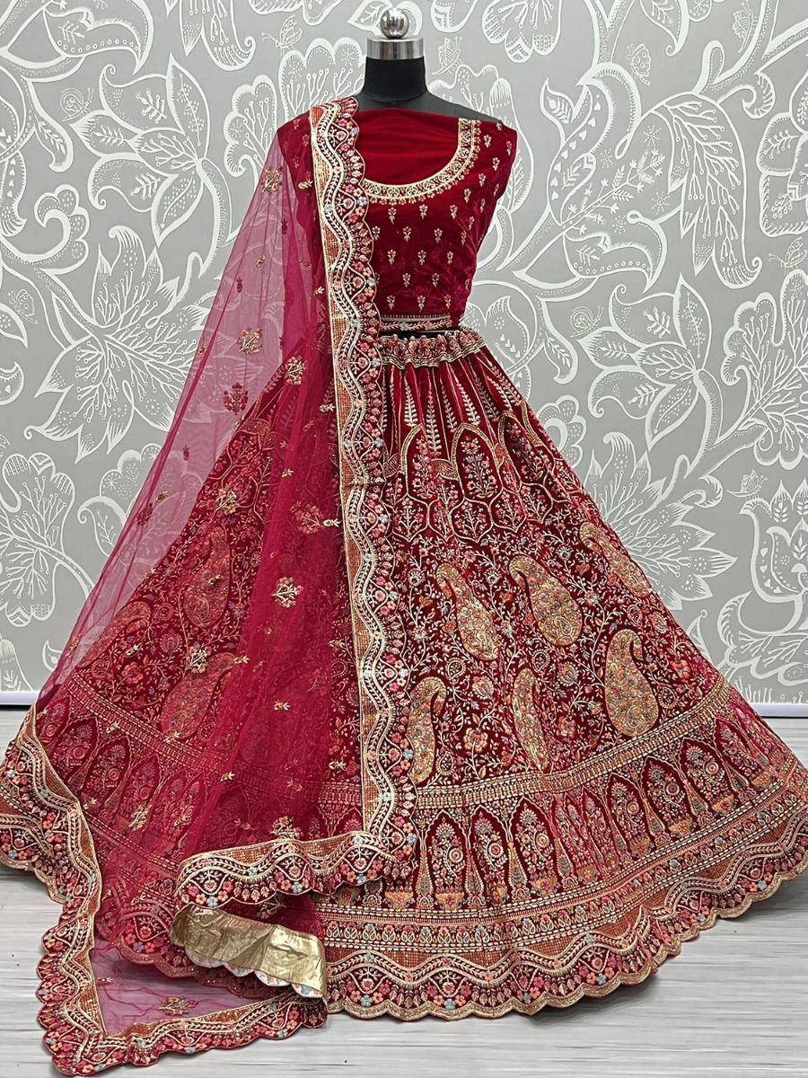 Maroon designer lehenga choli with heavy gold embroidery and paisley motifs, perfect for weddings and festivals