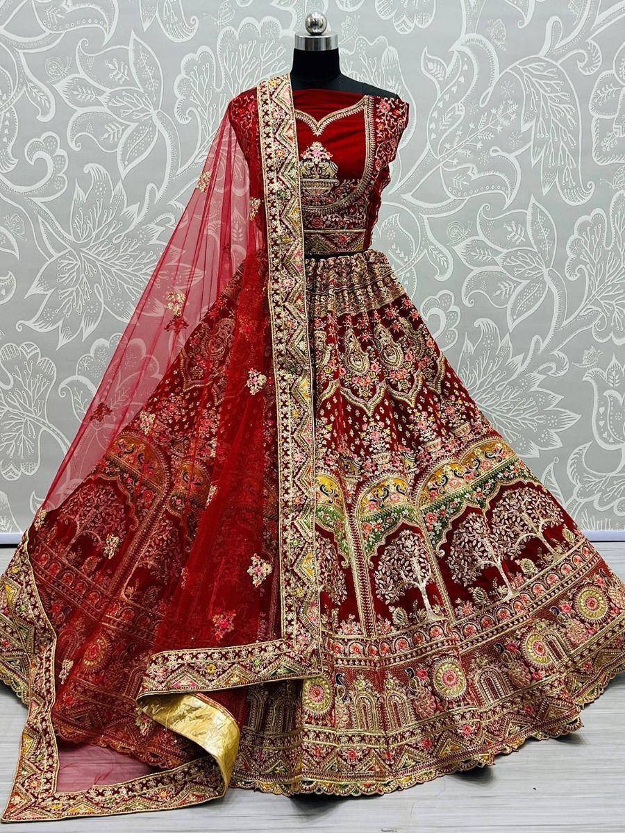 Red embroidered lehenga choli with gold detailing and sheer dupatta, perfect for Indian weddings and festive occasions